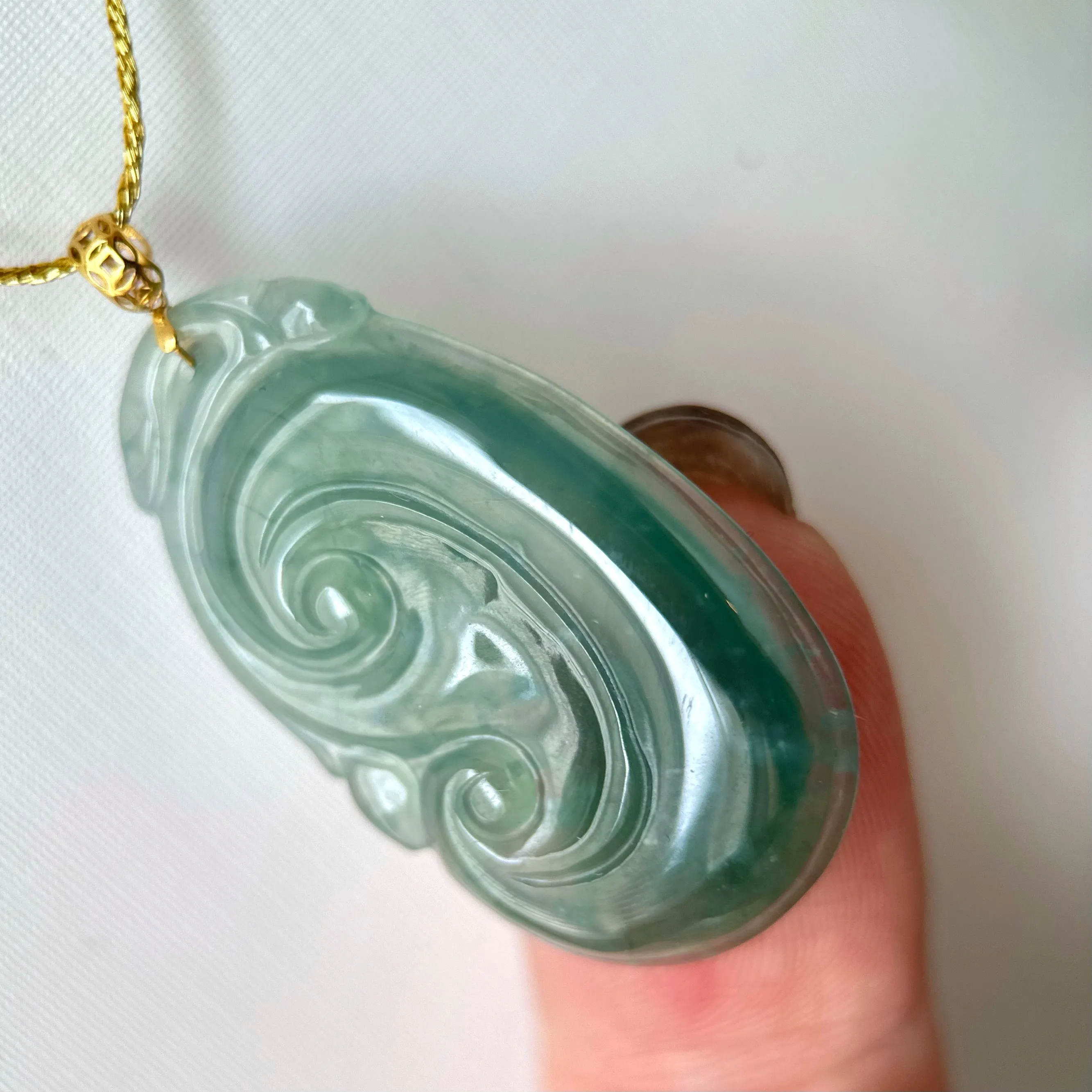 21988 Highly Translucent Bluish Green Ruyi Jade Pendant