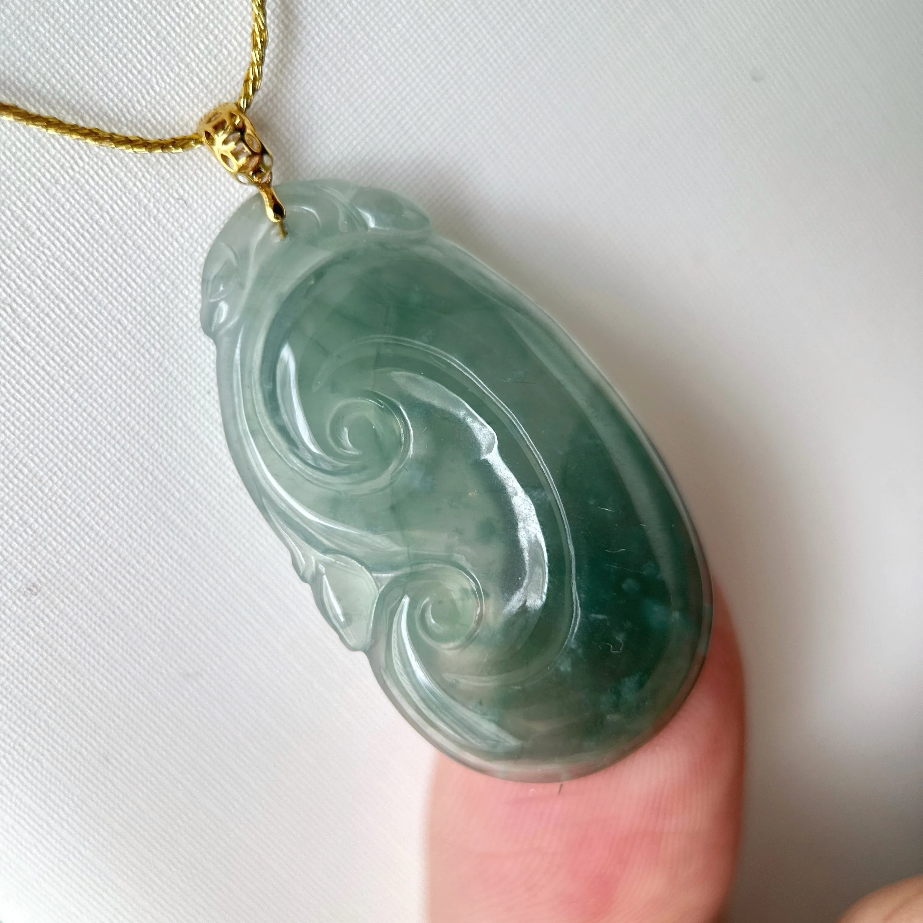 21988 Highly Translucent Bluish Green Ruyi Jade Pendant