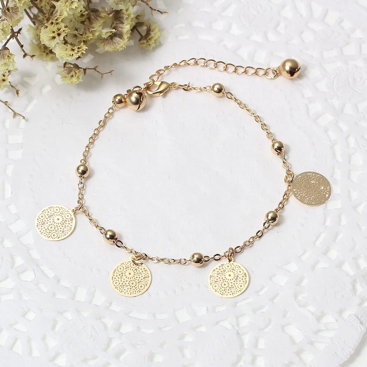 SEXY SPARKLES Filigree Stamping Bell Bracelet Gold Plated Whit Round Hollow Pendants